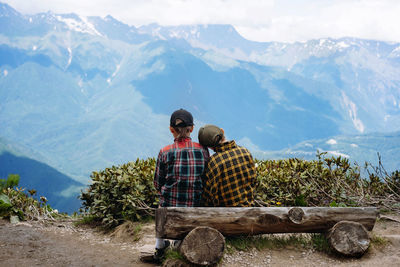 Rear view of man looking at townscape
