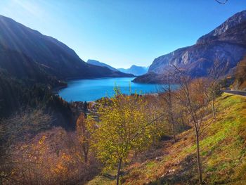 Scenic view of lake and mountains against clear sky