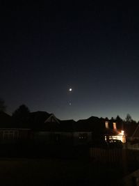 Scenic view of silhouette mountains against sky at night