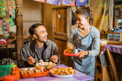 Friends having food at restaurant