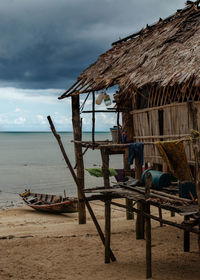 Built structure on beach against sky