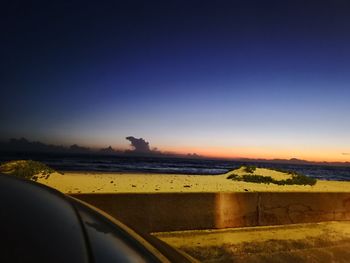 Scenic view of sunset seen through car windshield