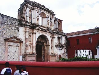 People in front of historical building