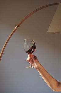 Close-up of hand holding glass of wine