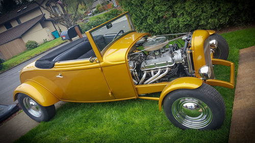 High angle view of yellow car on field