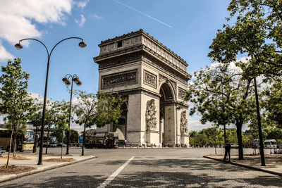 Low angle view of the arc de triomphe  against sky