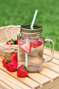 Close-up of strawberries in jar on table