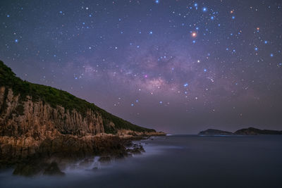 Scenic view of sea against sky at night