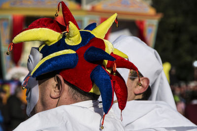 Close-up of men wearing masks at carnival