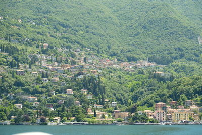 High angle view of townscape by mountain