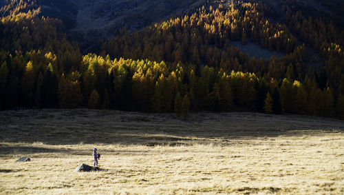 Sunny day on dolomites, walking on autumn landscape