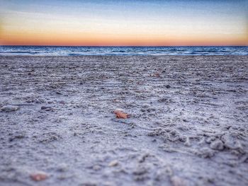 Scenic view of sea against sky at sunset