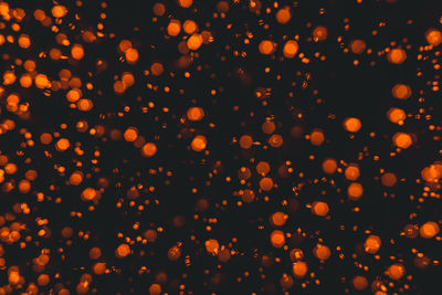 Defocused image of illuminated lights at night