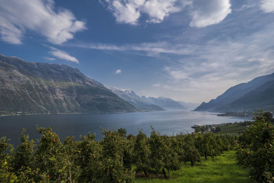 Scenic view of mountains against cloudy sky