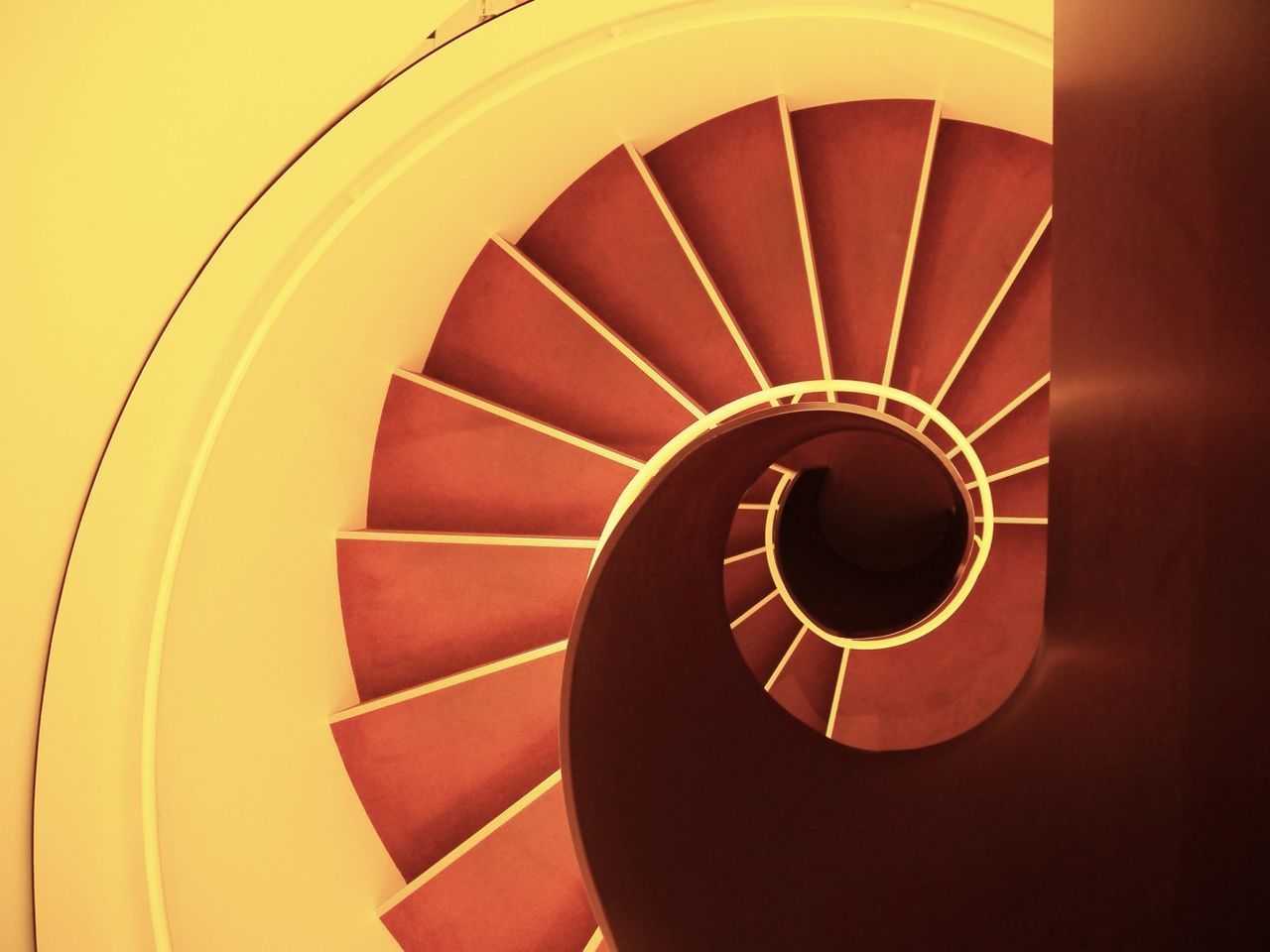 indoors, spiral, spiral staircase, steps and staircases, staircase, steps, pattern, built structure, architecture, railing, circle, design, geometric shape, low angle view, repetition, directly below, ceiling, shape, abstract, stairs