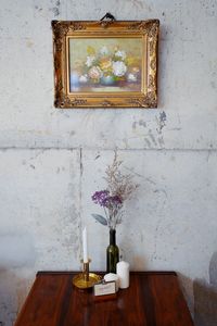 View of vase on table against wall at home