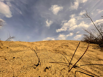 Scenic view of arid landscape against sky