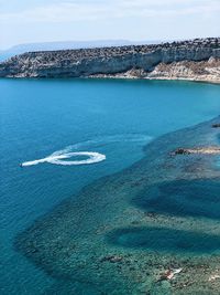 High angle view of sea shore against sky