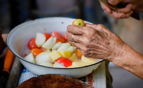 Midsection of man preparing food