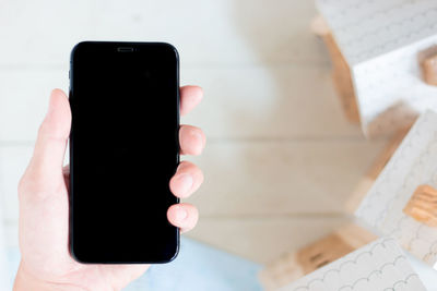 Close-up of hand holding smart phone