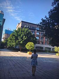 Full length of woman standing in park