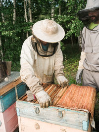 Rear view of man working in industry