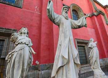 Low angle view of statue against building