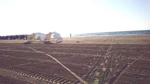 View of beach against clear sky