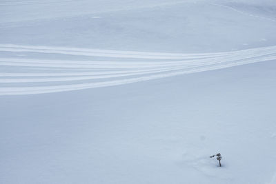 High angle view of person skiing on snowcapped mountain