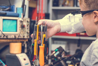 Close-up of boy in workshop