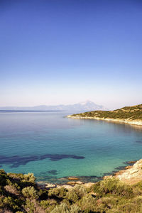 Scenic view of sea against clear blue sky