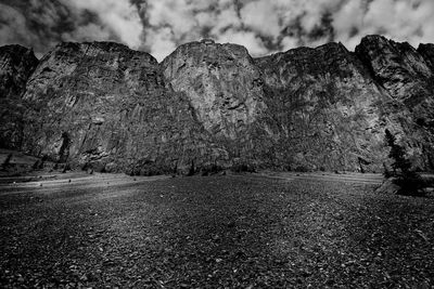 Scenic view of mountains against cloudy sky