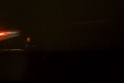 Close-up of illuminated lights in the dark