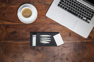 High angle view of coffee cup on table