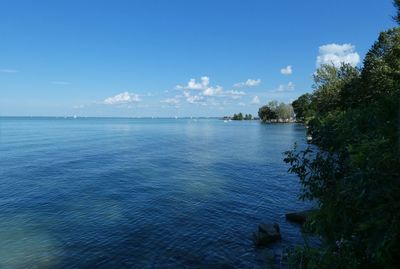 Scenic view of sea against blue sky