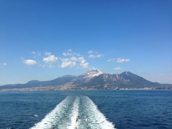 Scenic view of sea against blue sky