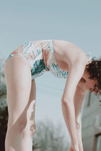 Midsection of woman against sky