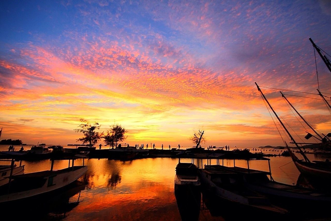 sunset, nautical vessel, transportation, mode of transport, boat, moored, water, orange color, sky, beauty in nature, cloud - sky, scenics, tranquil scene, tranquility, silhouette, nature, mast, reflection, sea, dramatic sky