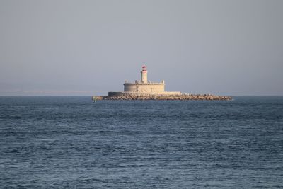 Lighthouse of islet at tagus river against sky