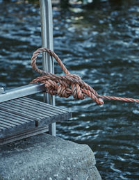 Close-up of rope tied on metal