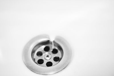 Close-up of water faucet in bathroom