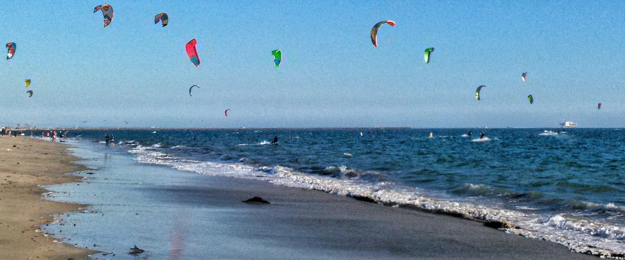 sea, water, horizon over water, beach, beauty in nature, scenics, blue, shore, nature, tranquility, tranquil scene, sky, wave, vacations, idyllic, sand, seascape, incidental people, coastline, day