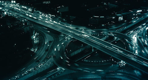 High angle view of illuminated highway at night