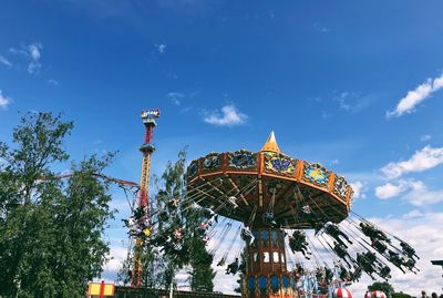 Low angle view of ferris wheel against sky