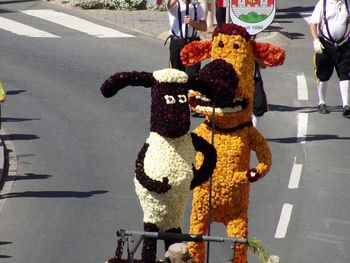 Low section of people standing on road