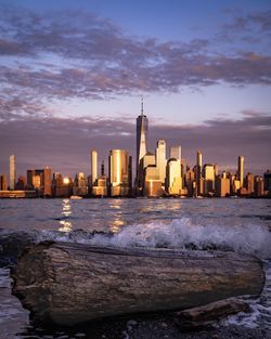 Modern buildings in city at sunset
