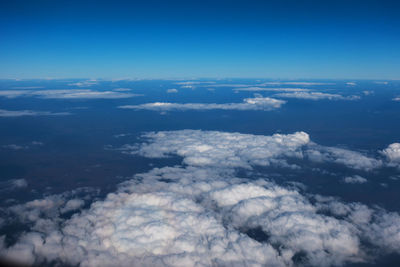 Aerial view of cloudscape against blue sky