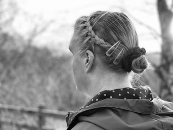 Close-up portrait of a serious young woman looking away