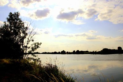 Scenic view of lake against sky during sunset