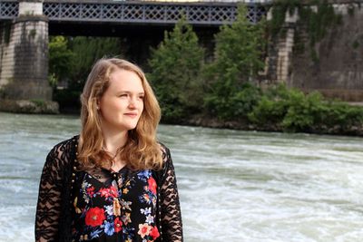 Portrait of a smiling young woman in water